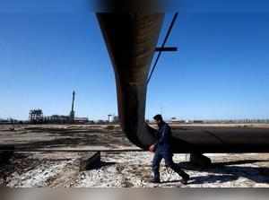 FILE PHOTO: A policeman walks at West Qurna-1 oil field, which is operated by ExxonMobil, in Basra