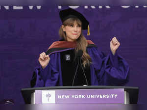 Taylor Swift attends NYU graduation ceremony at Yankee Stadium in New York