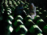 Bosnian muslim women mourn at Potocari Memorial Cemetery