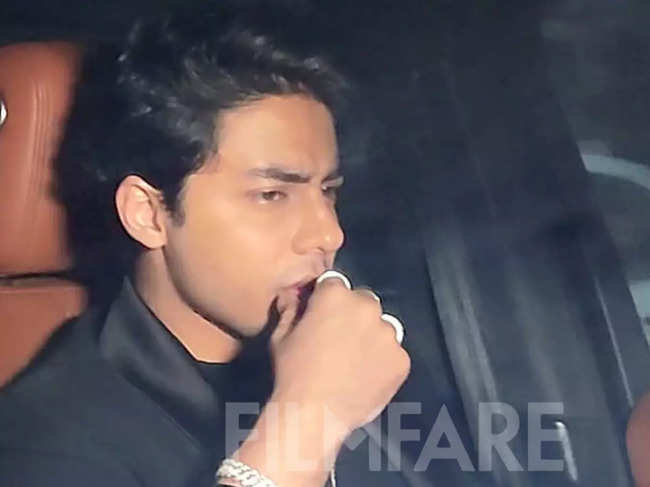 Aryan wore a black tailored suit with a black T-shirt and completed his look with a silver cross around his neck.