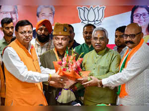 Dehradun: Uttarakhand Chief Minister Pushkar Singh Dhami and State BJP President...