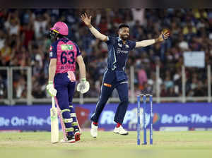 Ahmedabad: Hardik Pandya of Gujarat Titans celebrates the wicket of Jos Buttler ...