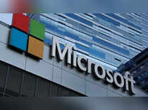 Microsoft warns of forex hit, cuts forecast