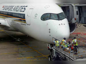 FILE PHOTO: A Singapore Airlines plane undergoes maintenance at Changi Airport in Singapore