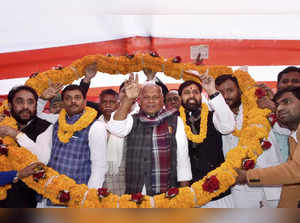 Patna: Hindustani Awam Morcha President Jitan Ram Manjhi being garlanded with ne...