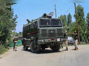 Baramulla: Security personnel during an encounter with militants, in Baramulla. ...