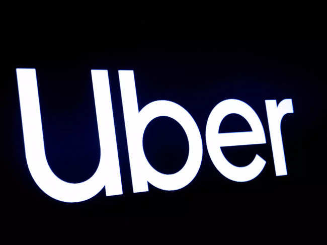 FILE PHOTO: FILE PHOTO: A screen displays the company logo for Uber Technologies Inc in 2019