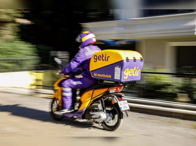 FILE PHOTO: Employee of Turkish fast grocery-delivery company Getir rides to deliver an online grocery delivery in Istanbul