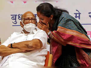 Mumbai, May 25 (ANI): NCP leader Supriya Sule interacts with her father and NCP ...