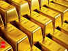 Gold slips as rise in US bond yields dent demand