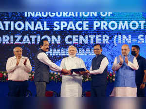 Ahmedabad: Prime Minister Narendra Modi receives a memento from IN-SPACe Chairma...