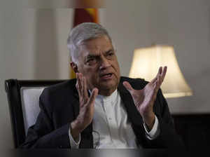 Sri Lanka's new prime minister Ranil Wickremesinghe gestures during an interview...