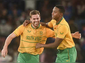 Cuttack: South African bowler Anrich Nortje celebrates with his teammate Kagiso ...