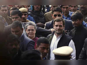 FILE PHOTO: Sonia Gandhi and Rahul Gandhi arrive at a court in New Delhi