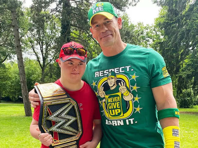 ​John Cena also gifted his shirt and hat to Misha Rohozhyn ​along with a WWE Championship belt.​