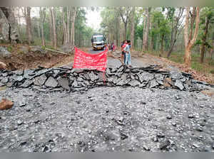 Narayanpur, Apr 19 (ANI): Naxalites block the road after digging and putting tre...