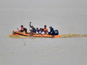 Hojai: State Disaster Response Fund (SDRF) personnel evacuate villagers during r...