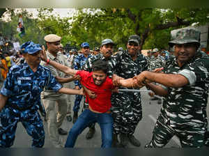New Delhi: Security personnel detain Indian Youth Congress (IYC) members during ...