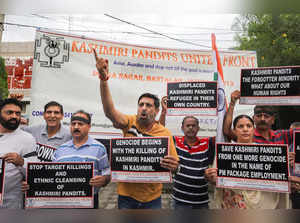 Jammu: Members of Kashmiri Pandit United Front raise slogans during a protest on...
