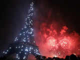 Fireworks burst over the Eiffel Tower