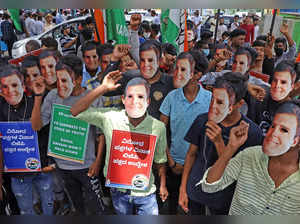 Bengaluru, Jun 16 (ANI): Congress supporters wear masks of party leader Rahul Ga...