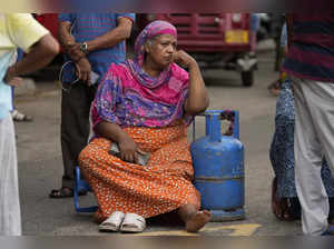 Colombo: An elderly woman sits outside a police station in a protest demanding c...