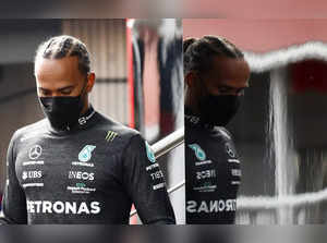 Montmelo : Mercedes driver Lewis Hamilton of Britain walks down stairs during a ...