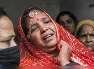 Udaipur: Yashoda, wife of tailor Kanhaiya Lal, mourns during his funeral process...