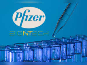 FILE PHOTO: Test tubes are seen in front of displayed Pfizer and Biontech logos in this illustration