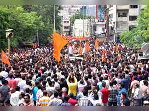 People attend a protest after the killing of a Hindu man in Udaipur
