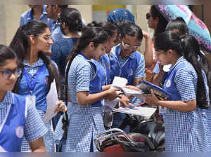 Gurugram: Students interact with each other after appearing for the CBSE class 1...