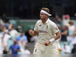 England's Stuart Broad celebrates taking the wicket of Australia's Cameron Green...