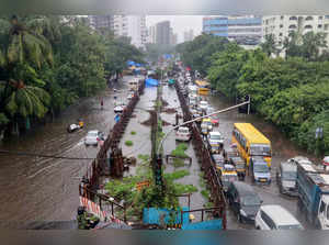 Mumbai: Vehicles stuck in a traffic jam on a waterlogged road following Monsoon ...
