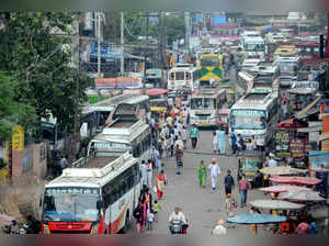 Amritsar: Punjab Roadways and PRTC employees close the entry gate with buses dur...