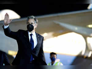 US Secretary of State Antony Blinken waves after disembarking his airplane at Bangkok .