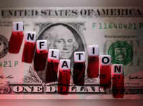 FILE PHOTO: Illustration shows plastic letters arranged to read "Inflation" are placed on U.S. Dollar banknote