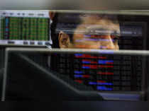 A trader looks at a screen at a stock brokerage firm in Mumbai