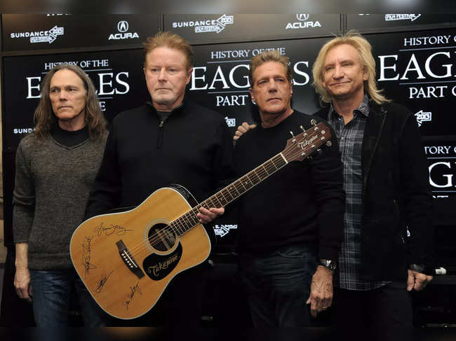 File photo of January 19, 2013​: Members of The Eagles, from left, Timothy B. Schmit, Don Henley, Glenn Frey and Joe Walsh pose with an autographed guitar after a news conference at the Sundance Film Festival, in Park City, Utah.