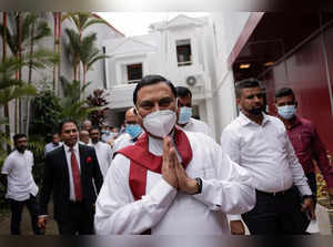 Basil Rajapaksa gestures as he leaves in Colombo