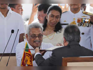 FILE - Then Sri Lanka's newly elected president Gotabaya Rajapaksa, center, hand...