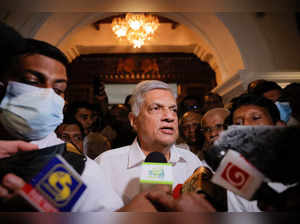 Ranil Wickremesinghe who has been elected as the Eighth Executive President under the Constitution arrives at a Buddhist temple
