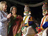 US Secretary of State Hillary Clinton greets traditional Indian dancers