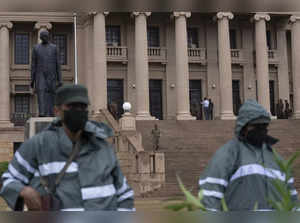 Army soldiers stand guard outside the Presidential Secretariat in Colombo, Sri Lanka