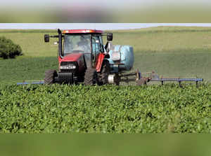 FILE PHOTO: A farmer sprays his cornfield in Hills, Iowa