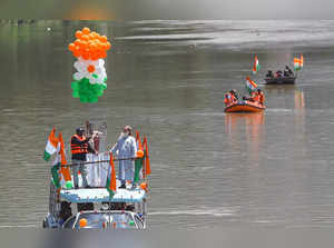 Srinagar: Kargil Vijay Divas victory flame being carried in a motor-boat to comm...
