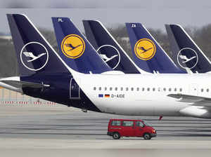 FILE --In this Thursday, March 26, 2020 file photo German Lufthansa planes sit p...