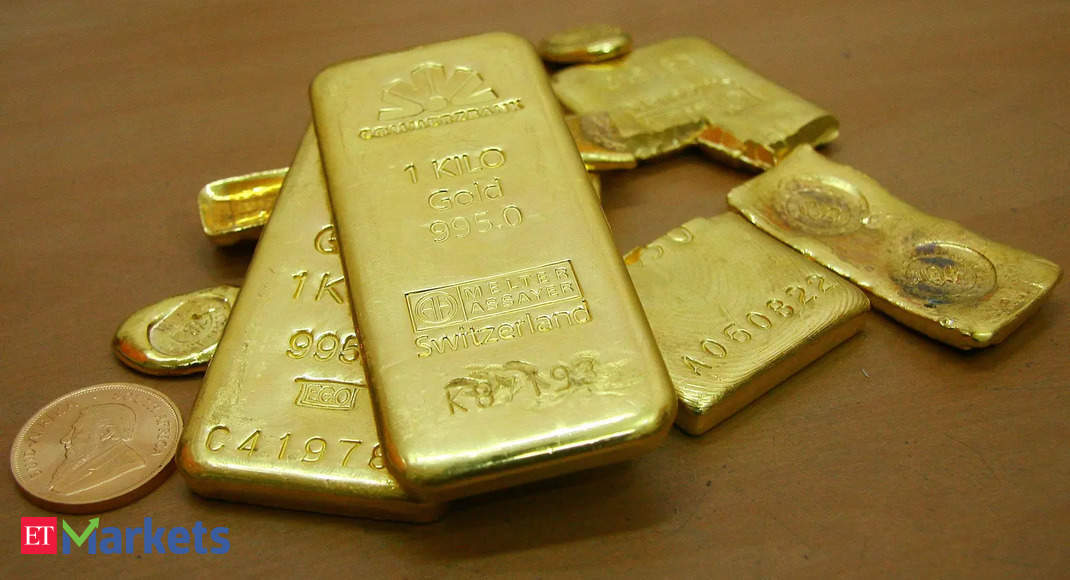 Gold rises as dollar, yields slip after Fed hike, Powell comments