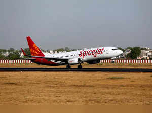FILE PHOTO: A SpiceJet Boeing 737 passenger aircraft takes off from Sardar Vallabhbhai Patel international airport in Ahmedabad