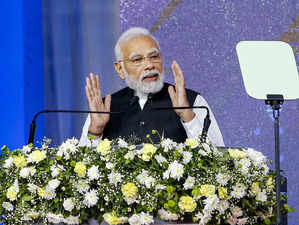 Gandhinagar: Prime Minister Narendra Modi addresses the ceremony for laying the ...