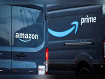 FILE PHOTO: Logos of Amazon and Amazon Prime are pictured on vehicles outside the Amazon Fulfilment Centre in Altrincham